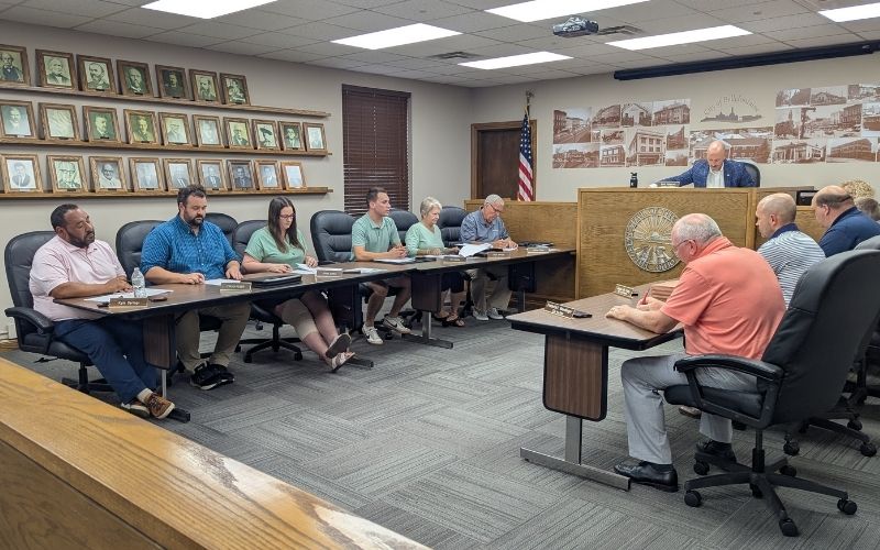 City balances global trips and local plans