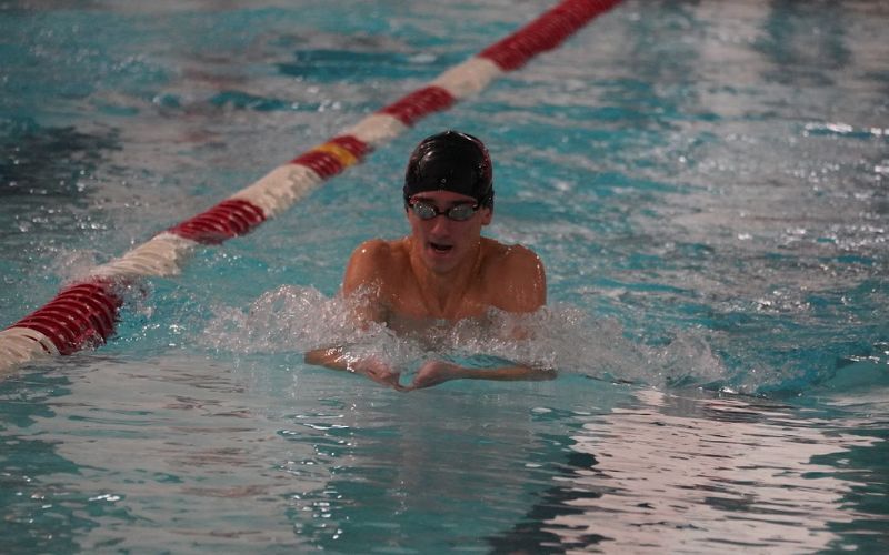 Chieftain swimmers split home opener